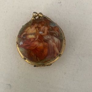 This cute title trinket box is empty. I bought it that way ,I loved the picture